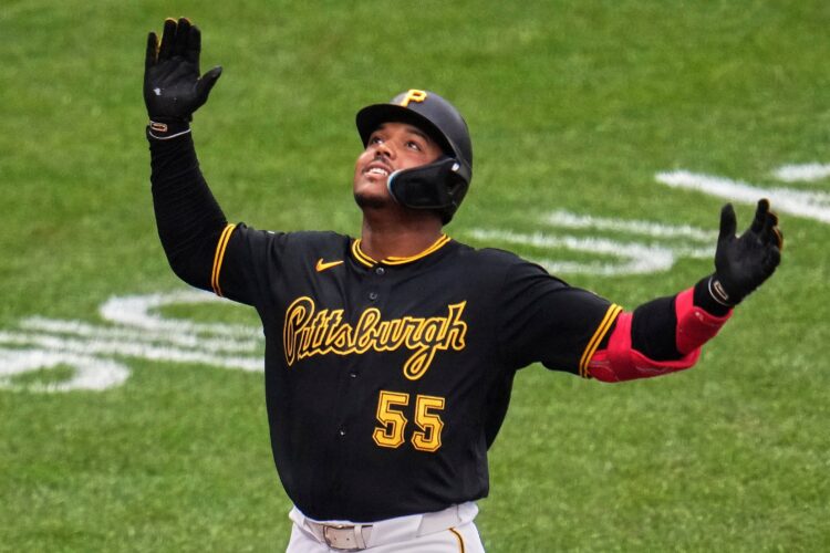 Reds rally for 9-7 win over Pirates